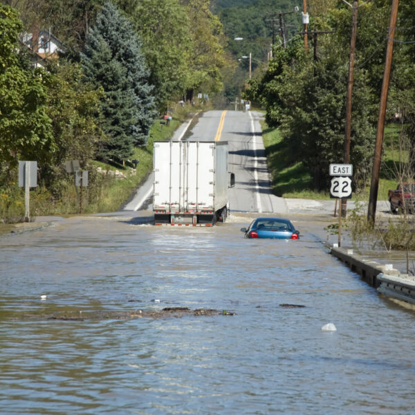 a car driving through a flooded road