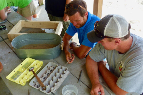 a person and a boy working on a project