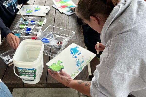 a person painting on a table