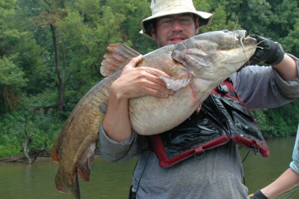 a man holding a large fish